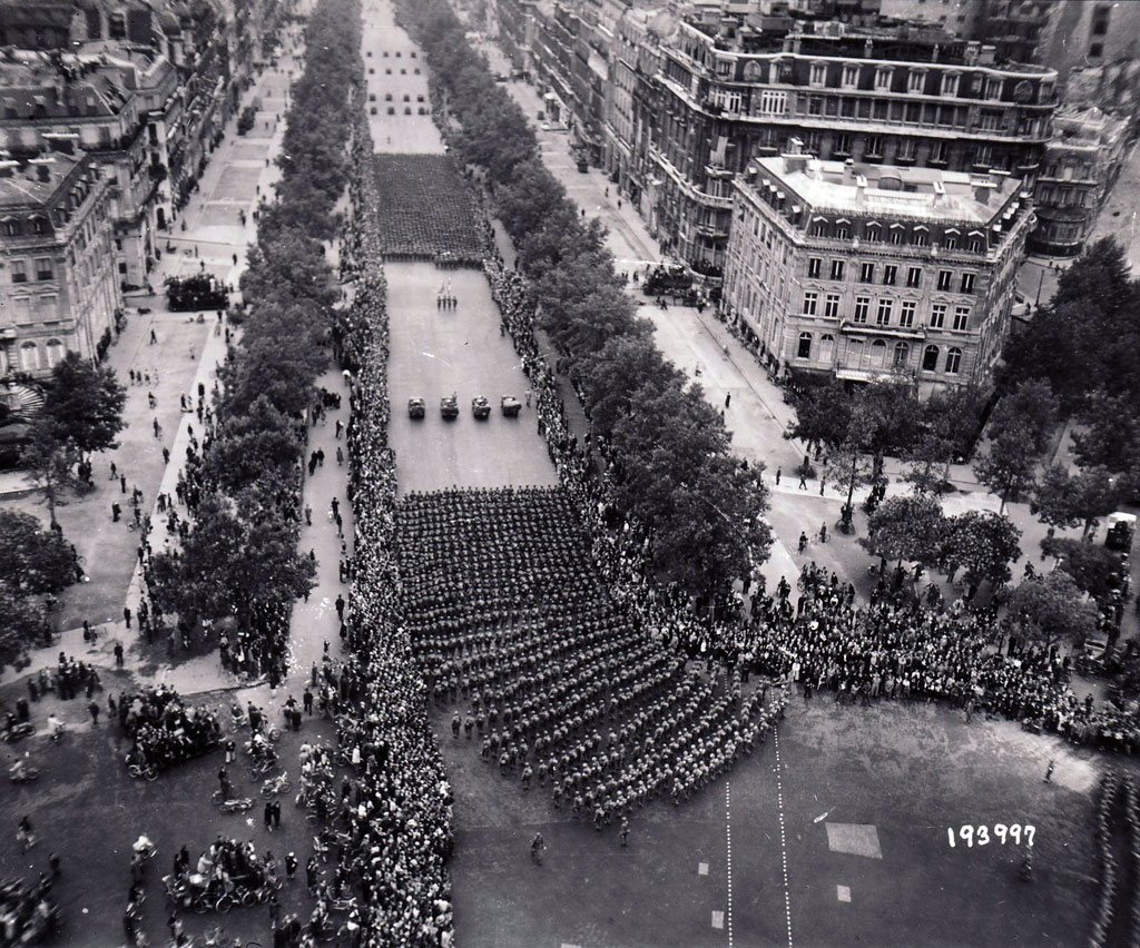 Parisians line the Champs Elysees on August 29 to cheer the U.S. 28th Infantry Division, marching through Paris before taking up pursuit of the German army to the east.